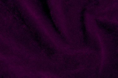 Purple velvet fabric texture used as background. violet fabric background of soft and smooth textile material. There is space for text.	