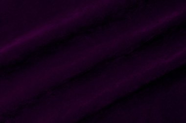 Purple velvet fabric texture used as background. violet fabric background of soft and smooth textile material. There is space for text.	