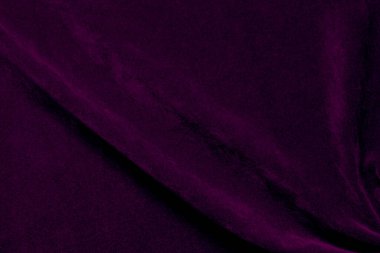 Purple velvet fabric texture used as background. violet fabric background of soft and smooth textile material. There is space for text.	