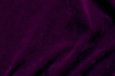 Purple velvet fabric texture used as background. violet fabric background of soft and smooth textile material. There is space for text.	