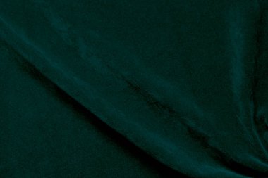 Green velvet fabric texture used as background. Ocean fabric background of soft and smooth textile material. There is space for text.	