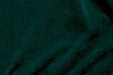 Green velvet fabric texture used as background. Ocean fabric background of soft and smooth textile material. There is space for text.	