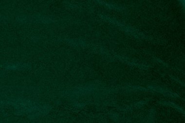 Green velvet fabric texture used as background. green fabric background of soft and smooth textile material. There is space for text.	