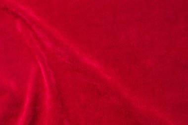 Red velvet fabric texture used as background. red fabric background of soft and smooth textile material. There is space for text.	