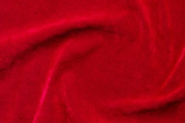 Red velvet fabric texture used as background. red fabric background of soft and smooth textile material. There is space for text.	