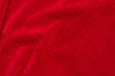 Red velvet fabric texture used as background. red fabric background of soft and smooth textile material. There is space for text.	