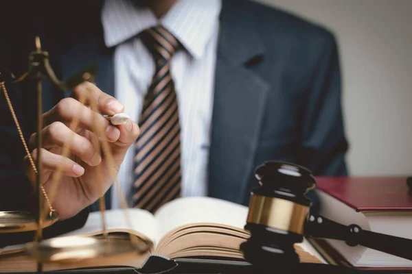 Lawyer's hand concept Justice  with Judge gavel, Businessman in suit or Hiring lawyers in the digital system. Legal law, prosecution, legal adviser, lawsuit, detective, investigation,legal consultant.