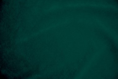 Green velvet fabric texture used as background. Empty green fabric background of soft and smooth textile material. There is space for text.	
