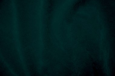 Green velvet fabric texture used as background. Empty green fabric background of soft and smooth textile material. There is space for text.	