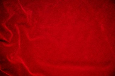 Red velvet fabric texture used as background. red fabric background of soft and smooth textile material. There is space for text..	