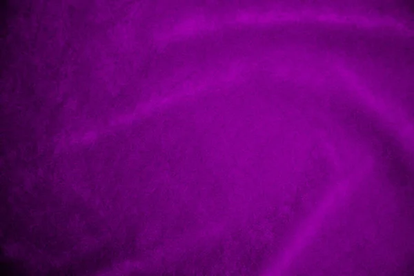 Purple velvet fabric texture used as background. Violet fabric background of soft and smooth textile material. There is space for text.