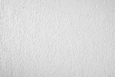 Beyaz taş dokusunun yüzeyi pürüzlü, gri-beyaz tonda. Duvar kağıdı veya arkaplan resmi için bunu kullanın. Metin beton duvar için boş bir alan var.