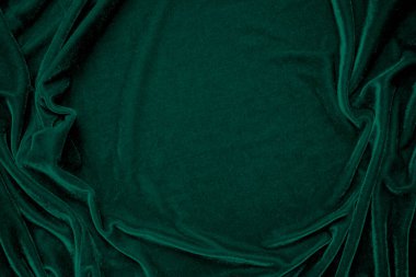 Green velvet fabric texture used as background. Peacock color panne fabric background of soft and smooth textile material. crushed velvet .luxury emerald tone for silk. clipart