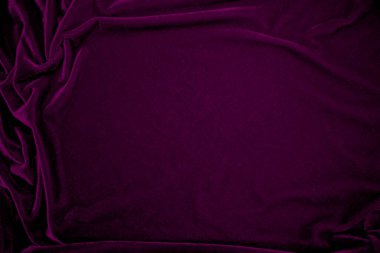 Arka plan olarak kullanılan pembe kadife kumaş dokusu. Yumuşak ve pürüzsüz tekstil malzemesinin şarap rengi panne kumaş arka planı. Ezilmiş kadife. İpek için lüks morumsu ton..