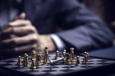 Businessman playing chess think problem solving. business competition planning teamwork,International chess, ideas and competition and strategy, business success concept,strategic concept..	