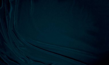 Arka plan olarak mavi kadife kumaş dokusu kullanılıyor. Yumuşak ve pürüzsüz tekstil malzemelerinin tavus kuşu renkli kumaş arka planı. Ezilmiş kadife. İpek için lüks donanma tonu..