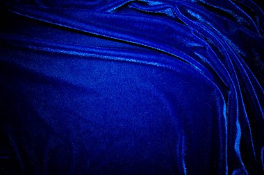 Dark bule velvet fabric texture used as background. Sky color panne fabric background of soft and smooth textile material. crushed velvet .luxury cobalt tone for silk.	