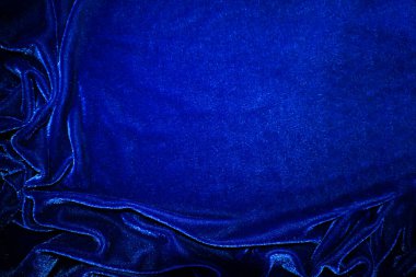 Dark bule velvet fabric texture used as background. Sky color panne fabric background of soft and smooth textile material. crushed velvet .luxury cobalt tone for silk.	