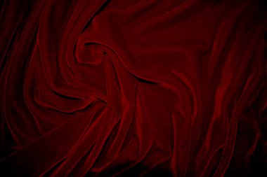 Red velvet fabric texture used as background. red panne fabric background of soft and smooth textile material. crushed velvet .luxury scarlet for silk.	