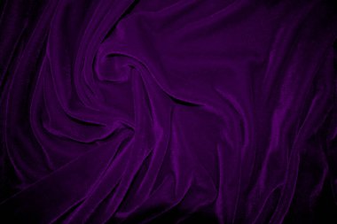 Purple velvet fabric texture used as background. Violet color panne fabric background of soft and smooth textile material. crushed velvet .luxury magenta tone for silk.	