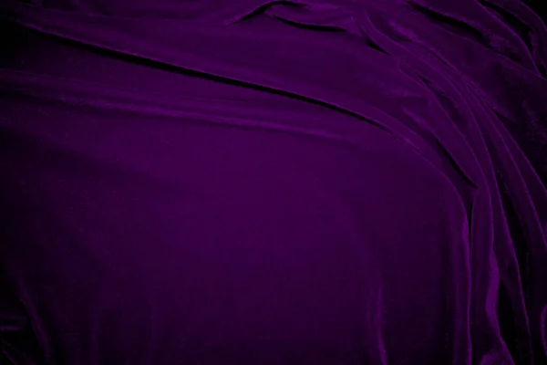 Purple velvet fabric texture used as background. Violet color panne fabric background of soft and smooth textile material. crushed velvet .luxury magenta tone for silk.