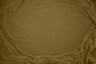 golden velvet fabric texture used as background. blond color panne fabric background of soft and light brown smooth textile material. crushed velvet .luxury yellow tone for silk.	
