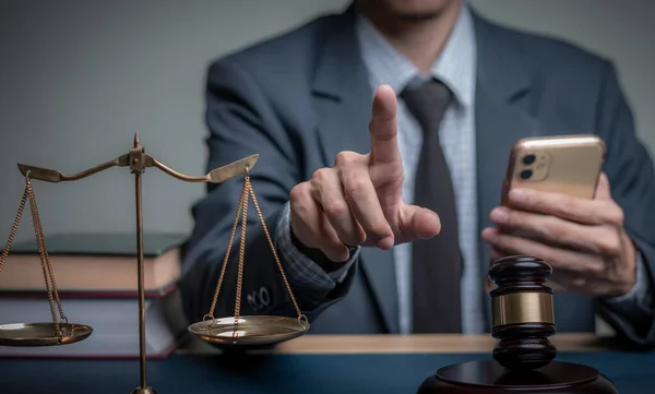 stock image Lawyer's hand concept Justice with Judge gavel, Businessman in suit or Hiring lawyers in the digital system. Legal law, prosecution, legal adviser, lawsuit, detective, investigation,legal consultant. 