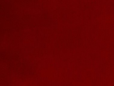 Arka plan olarak kırmızı kadife kumaş dokusu kullanılıyor. Yumuşak ve pürüzsüz tekstil malzemelerinin kırmızı paneli. Ezilmiş kadife. İpek için lüks kırmızı..
