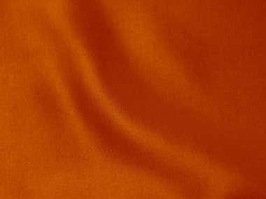 Orange velvet fabric texture used as background. orange fabric background of soft and smooth textile material. There is space for text.	