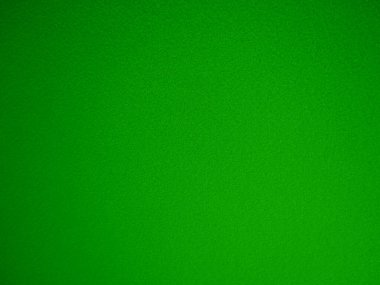Felt green soft rough textile material background texture close up,poker table,tennis ball,table cloth. Empty green fabric denim background.