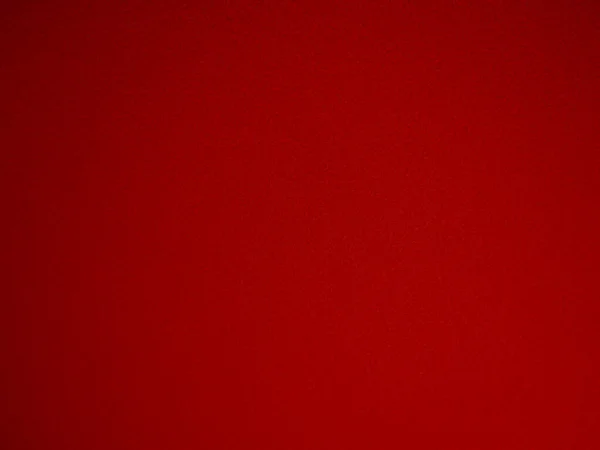Felt red soft rough textile material background texture close up,poker table,tennis ball,table cloth. Empty scarlet fabric background.