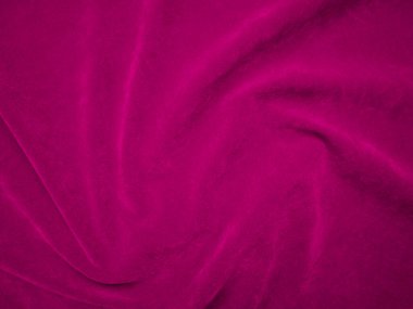 pink velvet fabric texture used as background. Wine color panne fabric background of soft and smooth textile material. crushed velvet .luxury magenta tone for silk.	