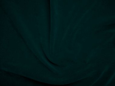Dark green velvet fabric texture used as background. Peacock color panne fabric background of soft and smooth textile material. crushed velvet .luxury emerald tone for silk..	