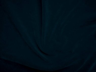 Blue velvet fabric texture used as background. Peacock color panne fabric background of soft and smooth textile material. crushed velvet .luxury navy tone for silk.	