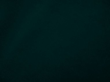 Dark green velvet fabric texture used as background. Peacock color panne fabric background of soft and smooth textile material. crushed velvet .luxury emerald tone for silk..	
