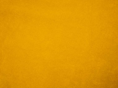 Yellow velvet fabric texture used as background. Empty yellow fabric background of soft and smooth textile material. There is space for text.	