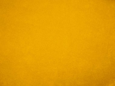 Yellow velvet fabric texture used as background. Empty yellow fabric background of soft and smooth textile material. There is space for text.	