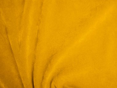 Yellow velvet fabric texture used as background. Empty yellow fabric background of soft and smooth textile material. There is space for text.	