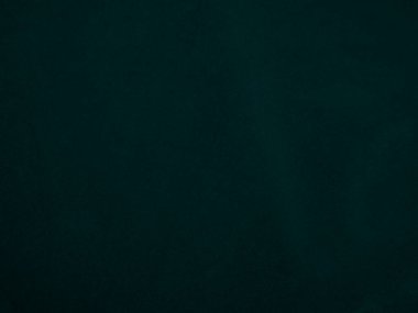 Dark green velvet fabric texture used as background. Peacock color panne fabric background of soft and smooth textile material. crushed velvet .luxury emerald tone for silk..	