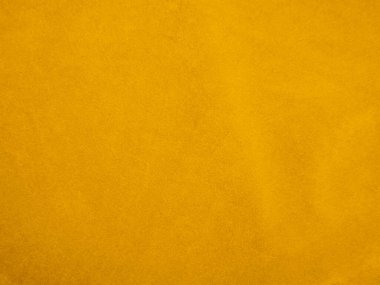 Yellow velvet fabric texture used as background. Empty yellow fabric background of soft and smooth textile material. There is space for text.	