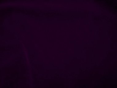 Dark purple velvet fabric texture used as background. Violet color panne fabric background of soft and smooth textile material. crushed velvet .luxury magenta tone for silk.	