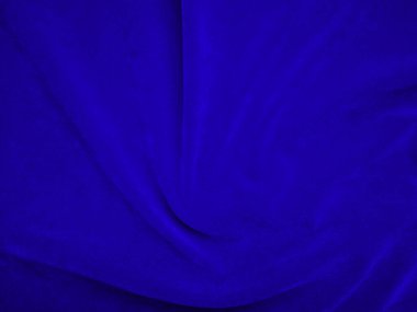 Dark blue velvet fabric texture used as background. Sky color panne fabric background of soft and smooth textile material. crushed velvet .luxury cobalt tone for silk.	