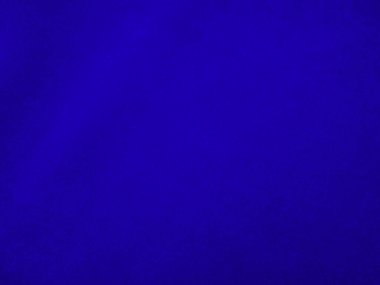 Dark blue velvet fabric texture used as background. Sky color panne fabric background of soft and smooth textile material. crushed velvet .luxury cobalt tone for silk.	