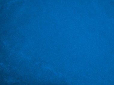 Arka plan olarak mavi kadife kumaş dokusu kullanılıyor. Yumuşak ve pürüzsüz tekstil malzemelerinin okyanus rengi panne kumaş arka planı. Ezilmiş kadife. İpek için lüks donanma tonu..
