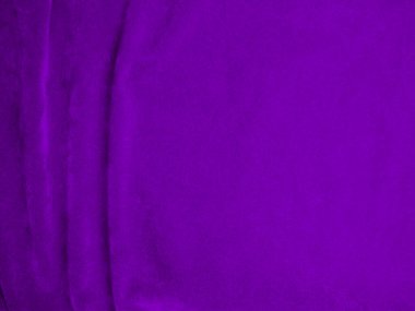 Purple velvet fabric texture used as background. Violet color panne fabric background of soft and smooth textile material. crushed velvet .luxury magenta tone for silk.	