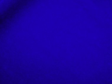 Dark blue velvet fabric texture used as background. Sky color panne fabric background of soft and smooth textile material. crushed velvet .luxury cobalt tone for silk.	