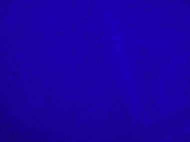 Dark blue velvet fabric texture used as background. Sky color panne fabric background of soft and smooth textile material. crushed velvet .luxury cobalt tone for silk.	
