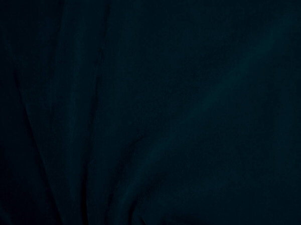 Blue velvet fabric texture used as background. Peacock color panne fabric background of soft and smooth textile material. crushed velvet .luxury navy tone for silk.	