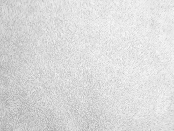 White clean wool texture background. light natural sheep wool. white seamless cotton. texture of fluffy fur for designers. close-up fragment white wool carpet.	