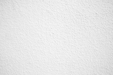 Beyaz taş dokunun yüzeyi pürüzlü, gri-beyaz tonda, boya duvarı. Duvar kağıdı veya arkaplan resmi için bunu kullanın. Metin için boş bir alan var. Bağbozumu için pürüzsüz doku beyaz.